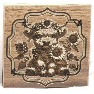 Coaster - Sitting Highland Cow